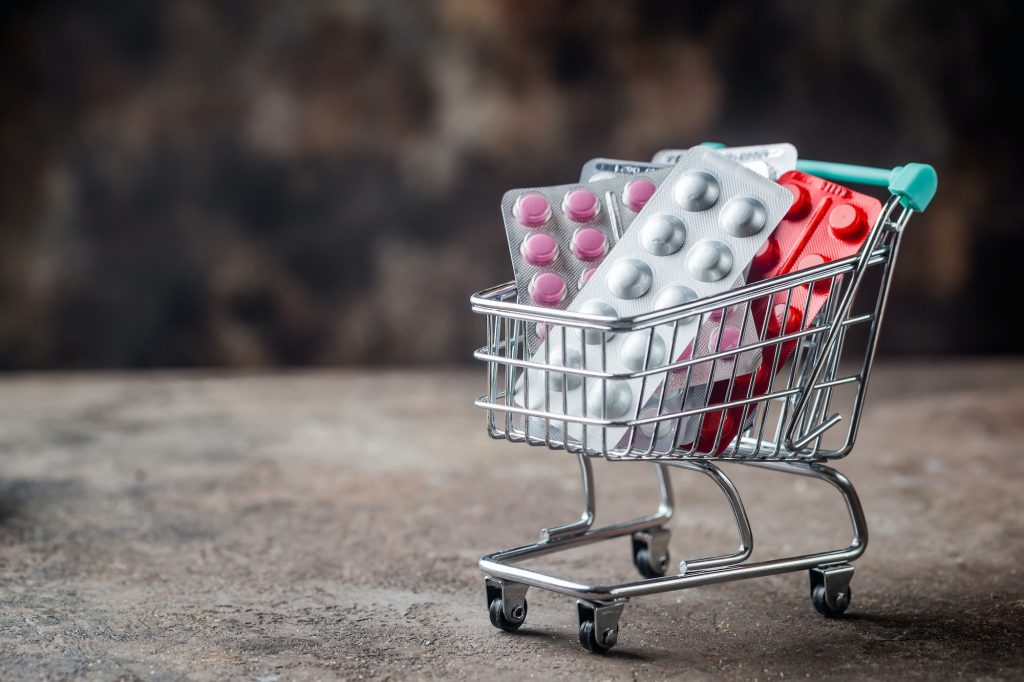 Shopping cart filled with pills.